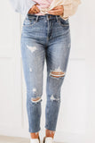 Risen Distressed Skinny Jeans